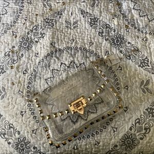 Clear and gold studded purse